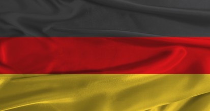 Flag of Germany with fabric textured background. Close up of National flag of Germany with