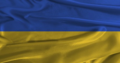 Flag of Ukraine with fabric textured background. Close up of National flag of Ukraine with
