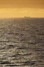 Silhouette, cargo ship, evening light, Baltic Sea