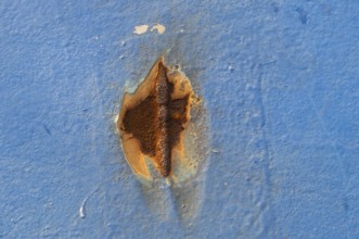Rust spot on blue painted wall, Finland ferry Helsinki to Travemünde, chimney and loading area,
