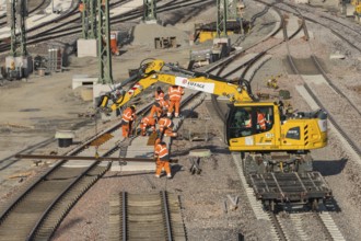 Track construction in progress using a large yellow construction machinery vehicle, Untertürkheim