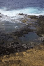 Coastal scene with rocks and waves hitting the cliffs. Dynamic natural scenery, Yaiza Lanzarote