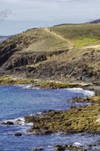 Coast with rugged hills and a hiking trail that snakes through the countryside, Puerto Calero