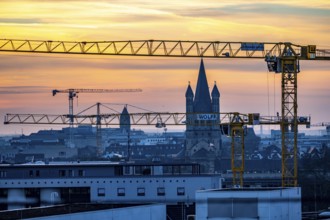 View of downtown Cologne, construction cranes from various construction sites, tower of Groß St.