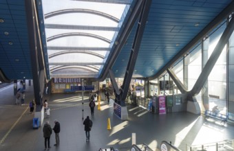 View from escalator of modern architecture of railway station concourse building, Reading,
