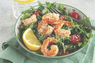Shrimp salad with arugula and cherry tomatoes, with parmesan cheese, healthy food