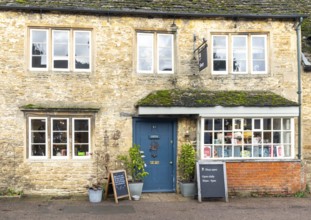 National Trust shop in historic Cotswold stone building, village of Lacock, Wiltshire, England, UK