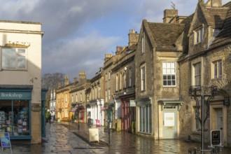 Wet pavements after rain in pedestrianised High Street are of town centre of Corsham Wiltshire,