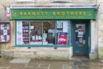 Frontage of traditional newsagent local shop, Barnett Brothers, High Street, Corsham, Wiltshire,