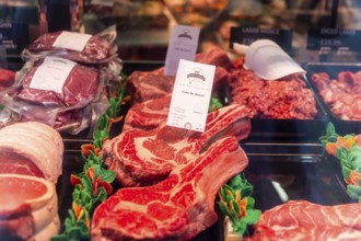Cote De Boeuf and other meat products in Toby Haynes Family Butcher shop window, Wiltshire,