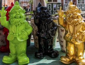 Colored garden gnomes, decoration in front of a shop in downtown Potsdam, Brandenburg, Germany