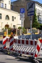 Barriers and traffic signs at a road construction site in the city center of Potsdam, Brandenburg,