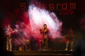 Flutist Dilip Hira performs during a cultural evening program at Shilpgram Mohotsav 2026 in