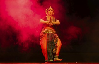 An artist perform Odissi classical dance during a cultural evening program at Shilpgram Mohotsav