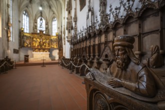 Carved half-figure, man with beard, oak choir stalls for monks' hour prayers, 1493 by Jörg Syrlin