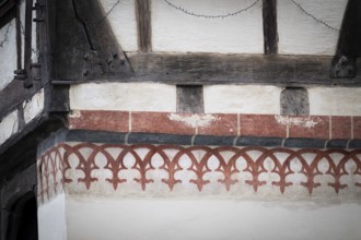 Reddish, painted decorative elements on an old half-timbered house, Blaubeuren Abbey building,