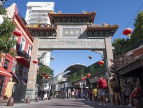 Tourists stroll in Chinatown with the Chinese archway, Buenos Aires, Argentina