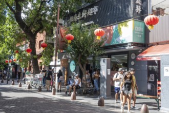 Tourists stroll in the Chinatown in front of a Chinese supermarket, Buenos Aires, Argentina