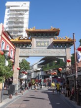 Tourists stroll in Chinatown with the Chinese archway, Buenos Aires, Argentina