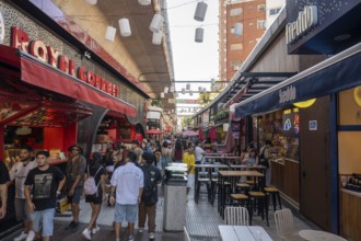 Tourists stroll in Chinatown with fast food shops, Buenos Aires, Argentina