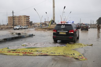 In Raqqa, Syria on January 18, 2026, a convoy of Syrian Government forces is seen advancing through