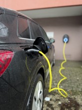 An e-car is charged at a wallbox, Wuppertal, Germany