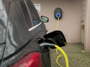 An e-car is charged at a wallbox, Wuppertal, Germany