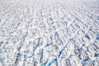 Aerial view of meltwater on the Greenland ice sheet, Arctic landscape, frozen wilderness, glaciers