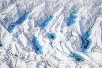 Aerial view of meltwater on the Greenland ice sheet, Arctic landscape, frozen wilderness, glaciers