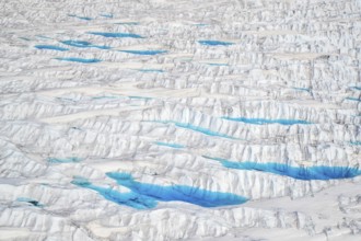 Aerial view of meltwater on the Greenland ice sheet, Arctic landscape, frozen wilderness, glaciers