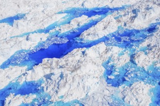 Aerial view of meltwater on the Greenland ice sheet, Arctic landscape, frozen wilderness, glaciers