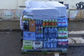 Pallet with drinks, covered in case of rain, Krakow, Poland