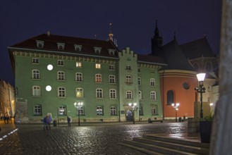 Small market square at night, Krakow, Poland
