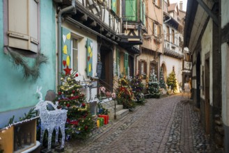 Christmassy decorated houses and alley with half-timbered houses, Christmas market, Eguisheim,