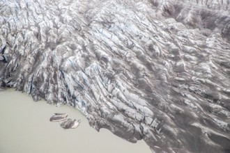 Aerial view of Greenland ice sheet and sea, Arctic landscape, frozen wilderness, glaciers and