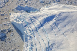 Aerial view of a big iceberg, Arctic landscape, frozen wilderness, glaciers and snow-covered