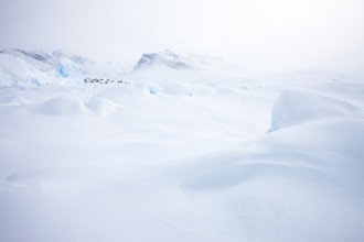 Tiniteqilaaq covered in snow during winter. The village is one of five settlements around