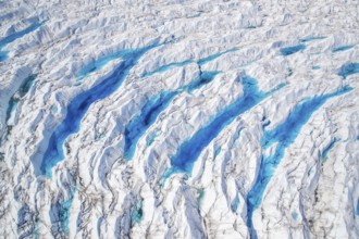 Aerial view of meltwater on the Greenland ice sheet, Arctic landscape, frozen wilderness, glaciers