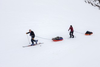 Tourists on a winter Arctic expedition skiing along Ikasartivaq Fjord, Sermersooq municipality,
