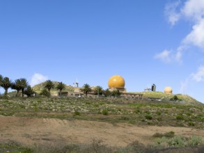 Radar domes on the Peñas del Chache against a blue sky, Caleta de Famara, Lanzarote, Canary