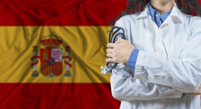Healthcare professional with Spain flag background. Professional doctor holding stethoscope on