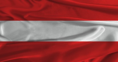Flag of Austria with fabric textured background. Close up of National flag of Austria with