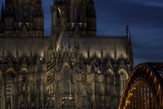 Evening atmosphere, Cologne Cathedral illuminated with LED lamps and the Hohenzollern Bridge,