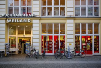 Weiland bookstore with bicycles parked in front of it, at the fish market in the Hanseatic City of