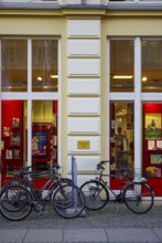 Bicycles parked in front of the Weiland bookstore at the fish market in the Hanseatic City of