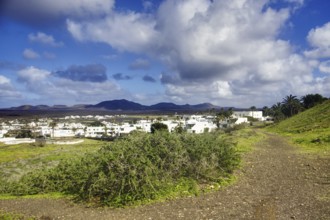 Path to the municipality of Yaiza at the foot of green hills, Yaiza Lanzarote