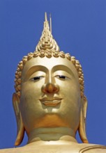 Portrait of the seated golden Buddha in Wat Phra Yai (Big Buddha Temple) at Hat Bangrak. The