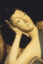 Reclining alabaster Buddha at Wat Sai Thai. The reclining Buddha symbolizes the last earthly hours