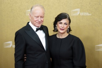 Stellan Skarsgard with woman Megan Everett, EUROPEAN FILM AWARDS Berlin 2026, photo call at the
