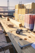 Building materials such as wood and tools on a construction site in the sun, carpentry, new